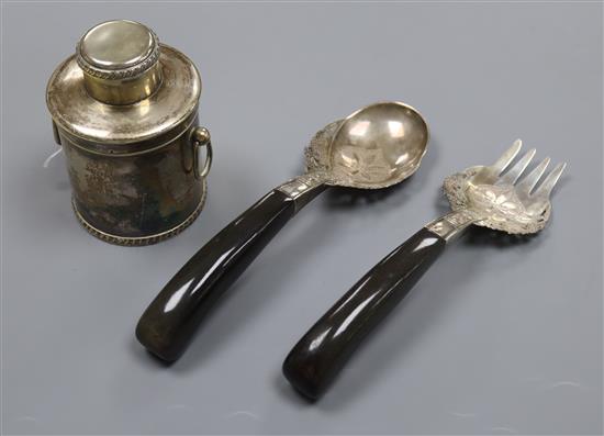 A pair of horn handled white metal servers and a plated tea caddy.